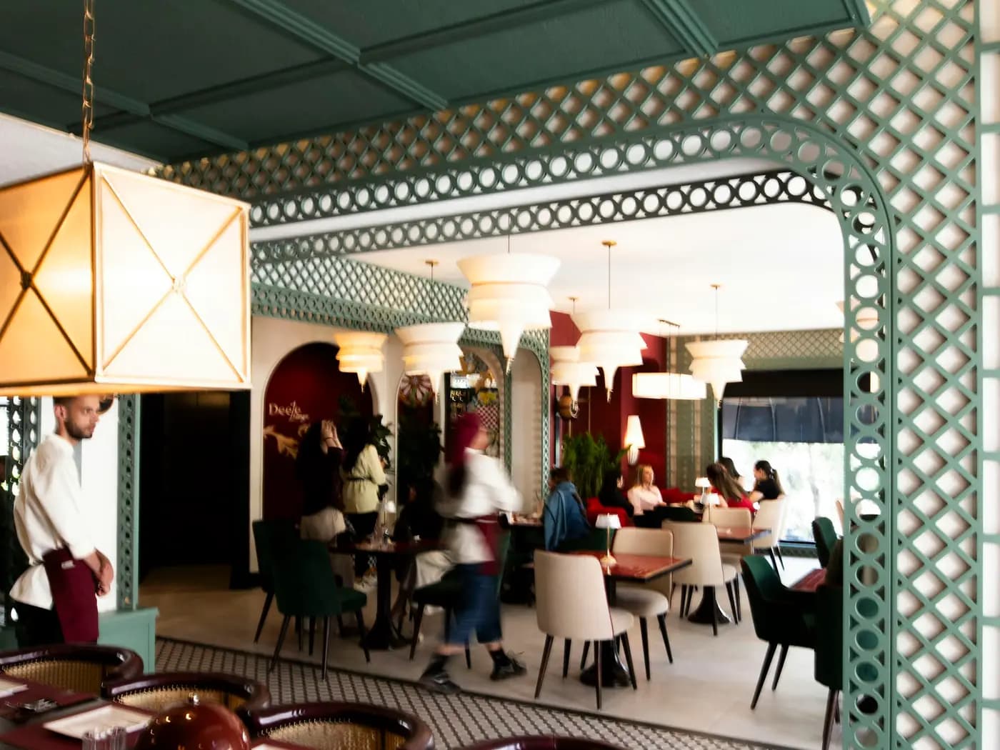 Guests and staff in a busy dine-in restaurant.